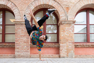 Energetic street dancer performing a lively acrobatic move