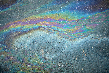 Iridescent oil spill generating a stunning, abstract pattern full of vivid colors.