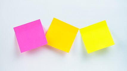 Fototapeta premium Colorful sticky notes arranged on a white surface