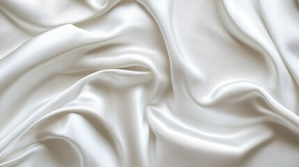 Obraz premium A close-up view of smooth, elegant white silk fabric, showcasing its luxurious texture and natural sheen, perfect for fashion or interior design projects.