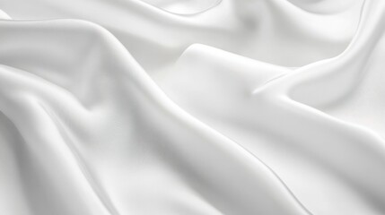 Obraz premium A close-up view of smooth, white fabric draping softly, showcasing its texture and elegance, perfect for fashion and interior design inspiration.