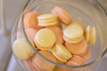  Colorful macaroons in a transparent glass vase on the table