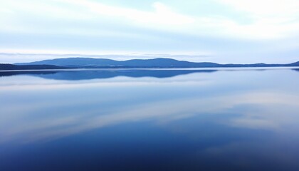 Fototapeta premium Tranquil Waters Mirroring the Azure Sky, Inspiring Peacefulness.