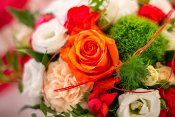 Wedding bouquet of different flowers on the table closeup