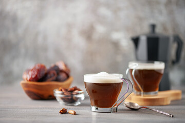 Cup with dates coffee  with date seeds. Healthy plant drink for immunity. Coffee alternatives