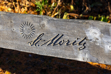 Logo of St. Moritz, Switzerland on a wooden board