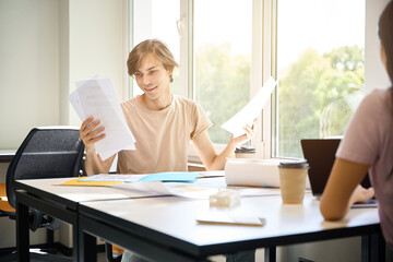 Young creatives work with documents