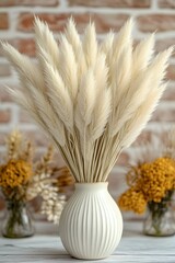 Naklejka premium Elegant Pampas Grass Arrangement in White Vase Against a Brick Wall for Home Decor