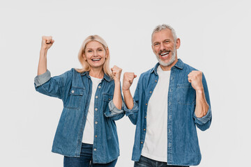 Happy joyful couple two friends elderly gray-haired man blonde woman in denim casual clothes...