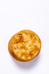 Golden light crispy and flacky butter puff biscuits on white background. Top view. Copy space.
