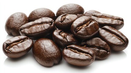 Obraz premium A handful of coffee beans isolated on a white background, showcasing their fresh and aromatic qualities.