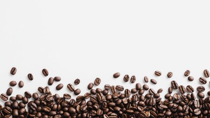 Obraz premium Coffee beans isolated on a clean white background, showcasing rich brown hues and natural texture.