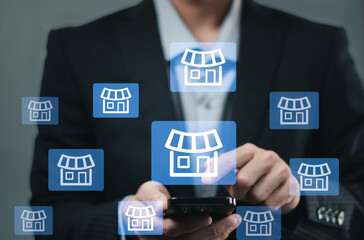 Hand choose franchise business store on arrow graph for franchising goal to growth branch expansion and business banking loan or consumer resources service.