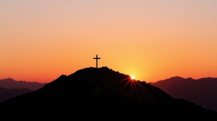 Silhouette of a Cross on Mountain at Sunrise