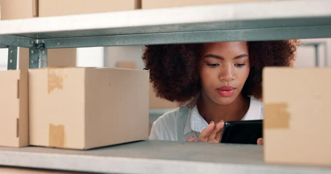 Tablet, reading and black woman in warehouse by boxes with online inventory, checklist or order. Technology, cargo and female distributor with parcel information for package logistics shipping.