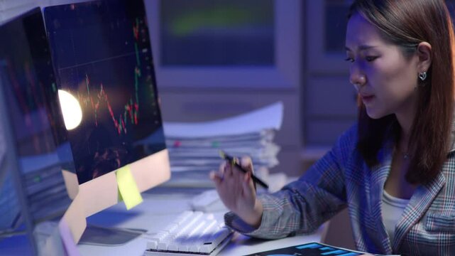 A disappointed business investor team focused loss profit individual analyzing stock market data on multiple screens in a dimly lit office environment.