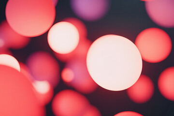 glowing red and pink spheres softly floating in space, shifting in size and intensity with smooth transitions to create a feeling of calm movement.