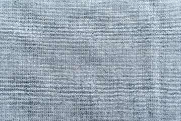 Texture of dense blue fabric for tailoring. Canvas. Textile. Material