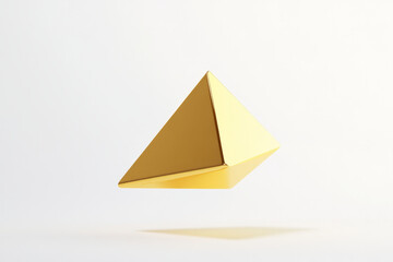 simple triangular shape in gold, gently moving in the air against a clean white backdrop, creating a stark contrast.