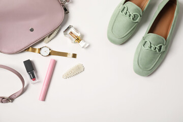 Stylish shoes, bag, perfume and accessories on white background, flat lay