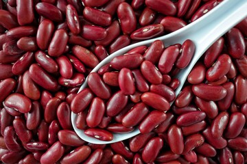 Pile of Red kidney beans in white spoon