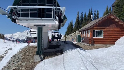Winter Scene Of Ski Lift Transporting Visitors Up A Snow-covered Mountain Slope