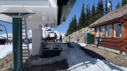 Spectacular View Of A Ski Lift Ascending A Snow-covered Hill Against Clear Blue Sky