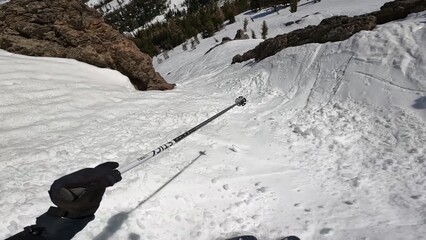 Winter Sporting Adventure: A Person Energetically Skiing Down A Snow-covered Mountain Slope