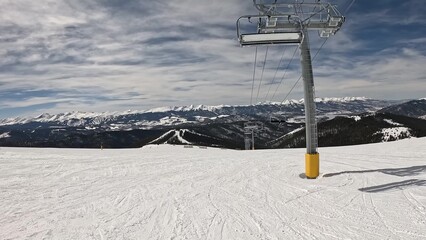 Active Person Kitted Out In Ski Gear Standing Alone On A Snowy Winter Slope