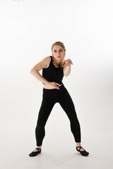 Obraz premium Dancer performing contemporary movement in a minimalistic studio setting during a creative rehearsal