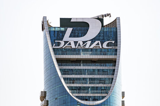 Damac development company logo on high building. Rooftop of glass skyscraper. Dubai, UAE - 1 NOV 2023