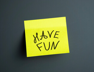 A bright yellow sticky note says Have fun in bold black ink