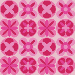 Obraz premium Seamless pattern of geometric abstract flowers in red and pink tones. Flowers are arranged in a dense grid. Modern floral design for textiles, wallpapers, and digital projects.