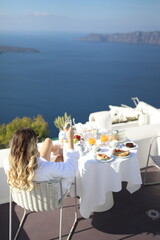 Blonde girl in Santorini Greece