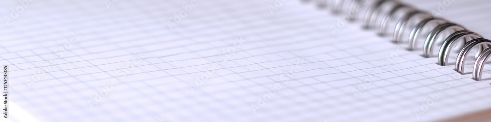Poster a close-up view of a spiral notebook's pages, with the cover and edges in focus