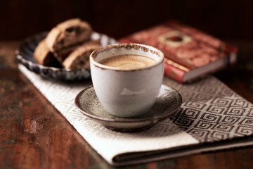 Cup of coffee and Cantuccini (Italian cookie) on dark wooden background. Copy space.	