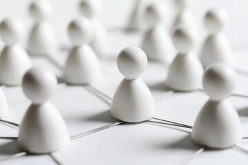 Obraz premium Group of small white sculptures sitting on a white background
