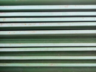 Detail of a iron green striped background