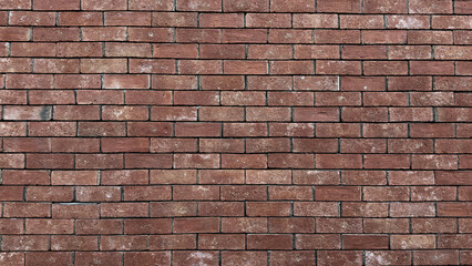 A brick wall with a few missing bricks. The wall is brown and has a rough texture. The missing bricks give the wall a somewhat unfinished look
