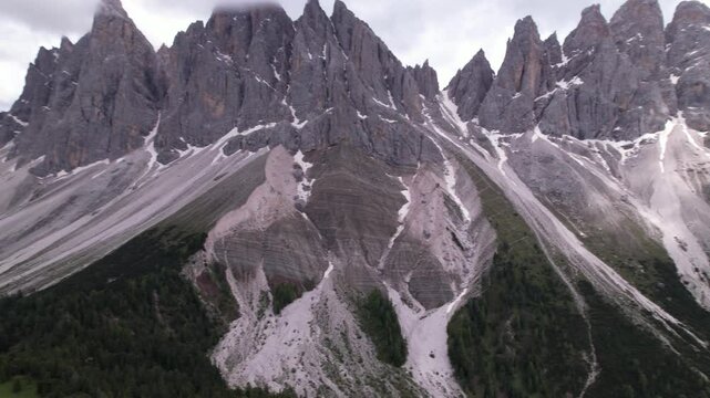 DRONE AERIAL FOOTAGE - The Odle Group is an impressive mountain range in the Dolomites, Bolzano, Trentino Alto Adige, Italy. The main peak of this massif is Mt. Sass Rigais.