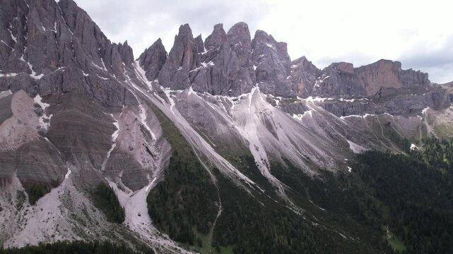DRONE AERIAL FOOTAGE - The Odle Group is an impressive mountain range in the Dolomites, Bolzano, Trentino Alto Adige, Italy. The main peak of this massif is Mt. Sass Rigais.
