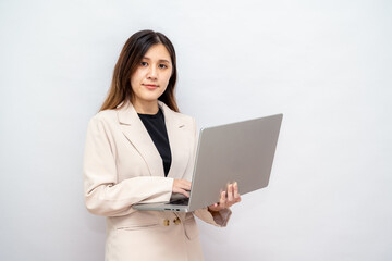 Confident Businesswoman Holding a Laptop in a Professional Setting,Corporate Lady Using a Laptop for Business and Technology