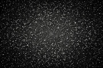 Obraz premium Water and rain drops on black background with stars and galaxy pattern, creating a dark, wintery texture with a space theme