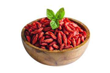 A wooden bowl of vibrant goji berries garnished with fresh green basil leaves., transparent background.