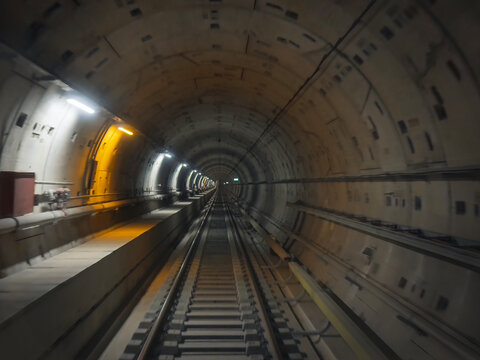 Fototapeta Driverless metro train travels through an underground tunnel in Thessaloniki.