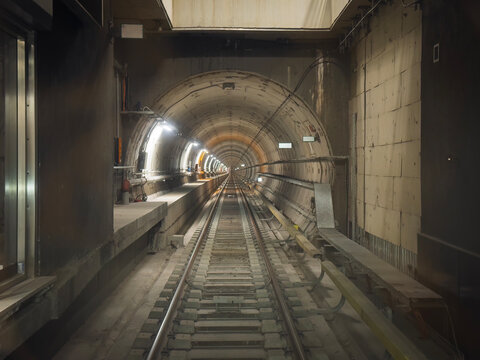 Fototapeta Driverless metro train travels through an underground tunnel in Thessaloniki.