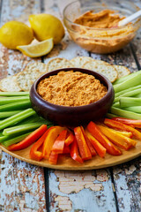 roasted red pepper hummus served with fresh vegetables for dipping