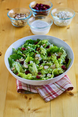 mixed green salad with dried fruit and nuts