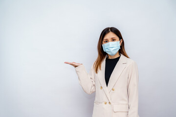 Businesswoman Wearing a Mask Pointing Somewhere