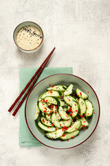 Chinese salad, cucumbers with chili pepper and sesame seeds, homemade, no people,